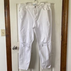 White jeans with rips in the knees, high rise, and skinny. Ms. Cello brand.